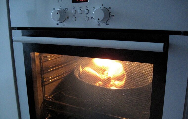 Built-in oven with the interior light on during baking